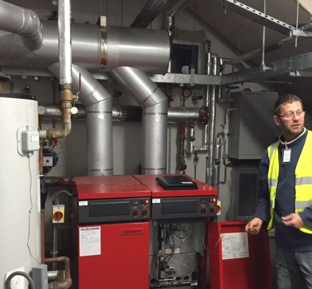 Engineer servicing a commercial boiler plant room