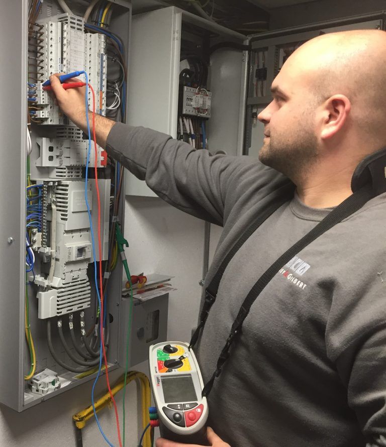 Engineer testing a consumer unit
