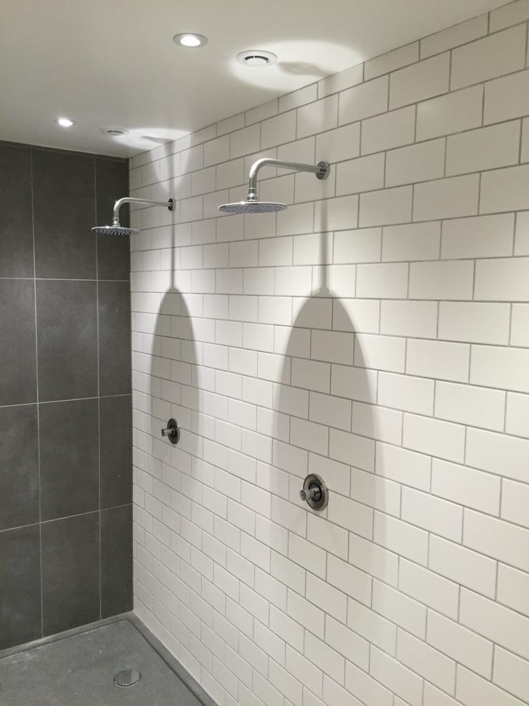 Twin rainfall shower in a tiled wet room