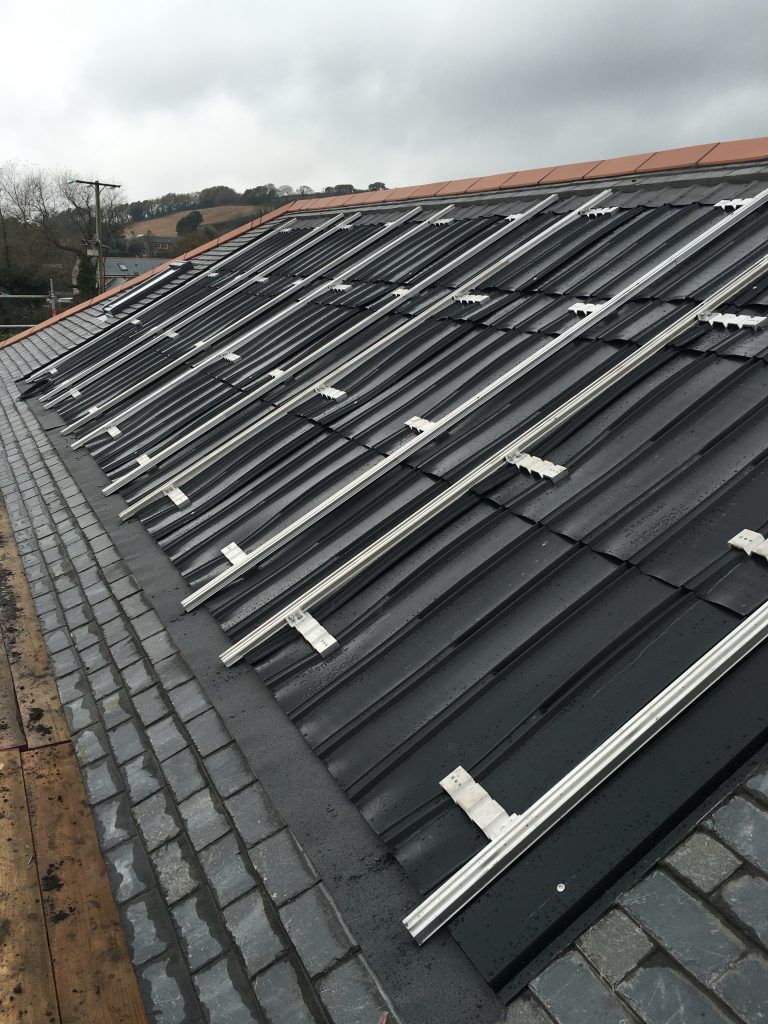 Mounting rails on a slate roof