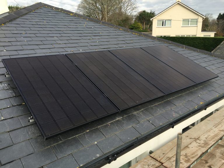 Black solar PV panels on a slate roof