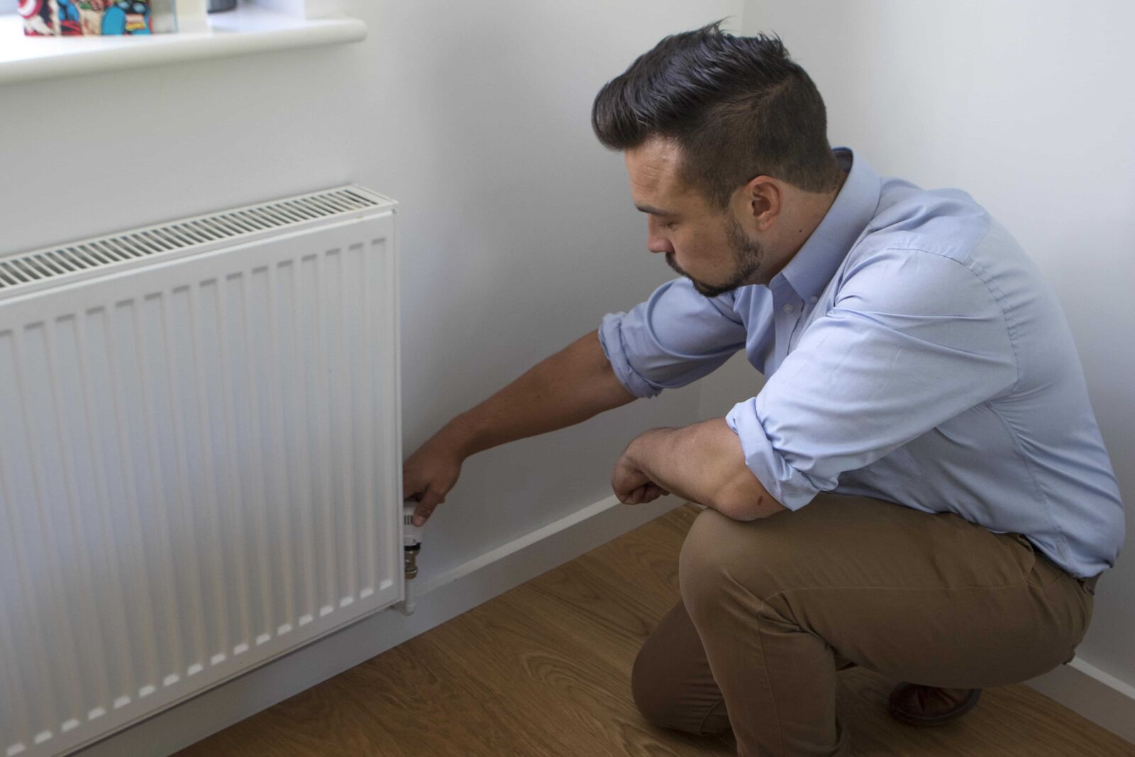 Davey & Gilbert engineer fitting a radiator